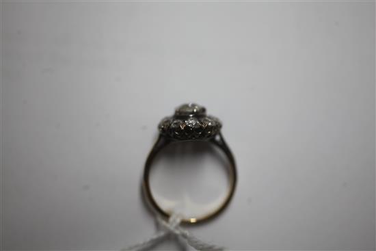 An early 20th century 18ct gold and diamond cluster ring, size K.